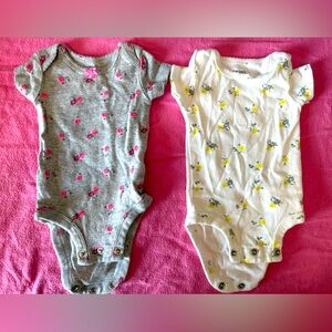 two Carters onesies for newborns.